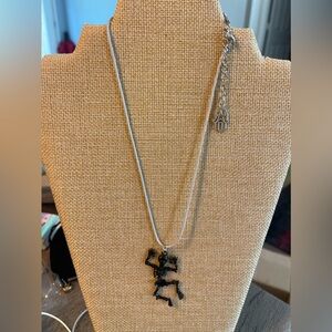 Dancing skeleton necklace in black on light cord